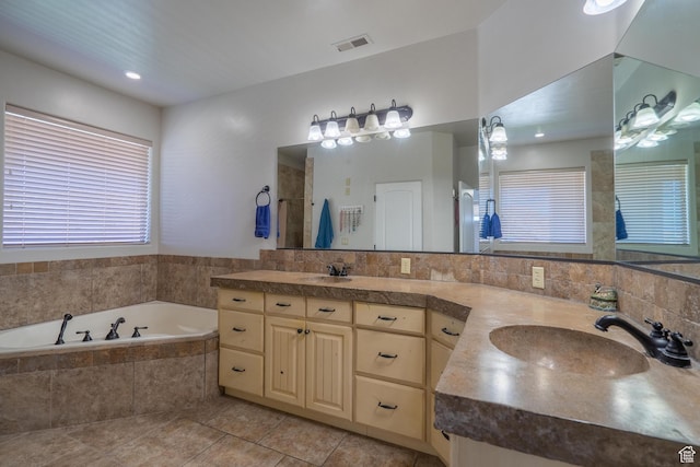 2042 Westcliff Dr, St George, UT 84790 - bathroom with a garden tub, tile patterned floors, a sink, a tile shower, and visible vents