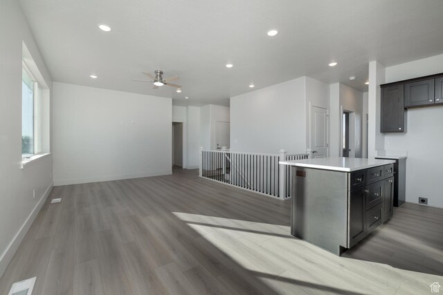 kitchen featuring a kitchen island and light hardwood / wood-style floors