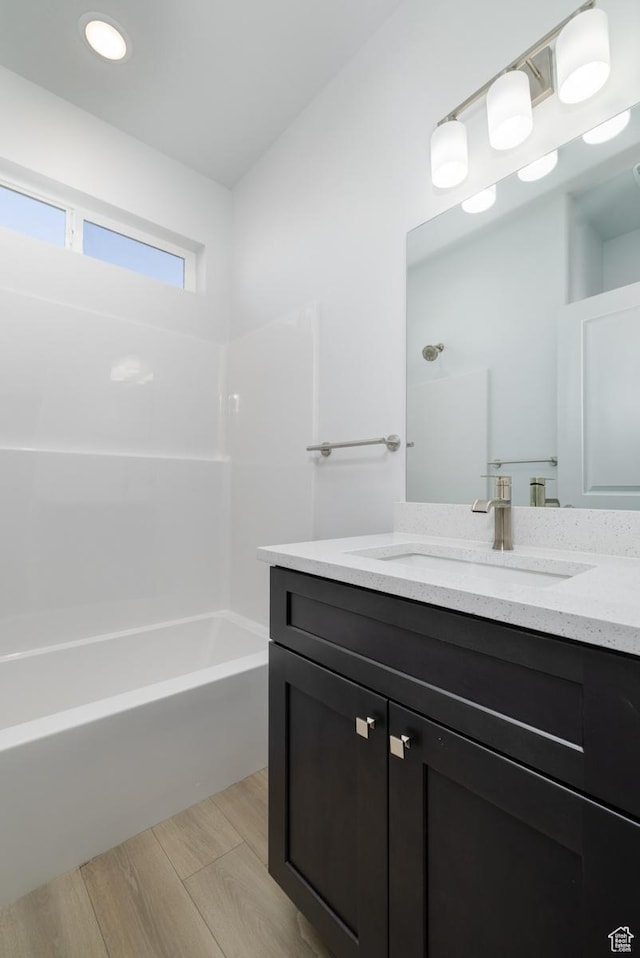 bathroom with vanity and tub / shower combination