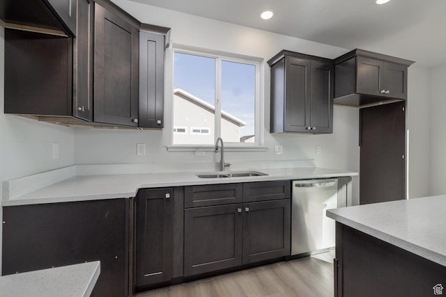 kitchen with dark brown cabinetry, sink, light hardwood / wood-style flooring, and dishwasher