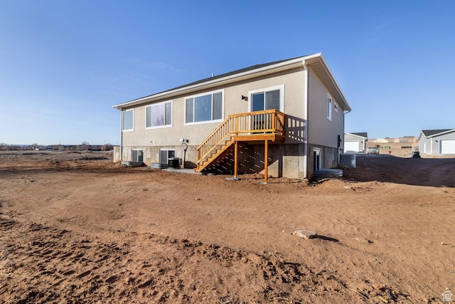rear view of house featuring cooling unit