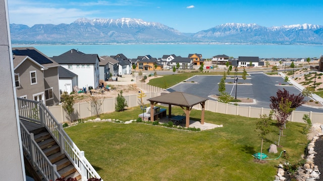 bird's eye view with a residential view and a water and mountain view