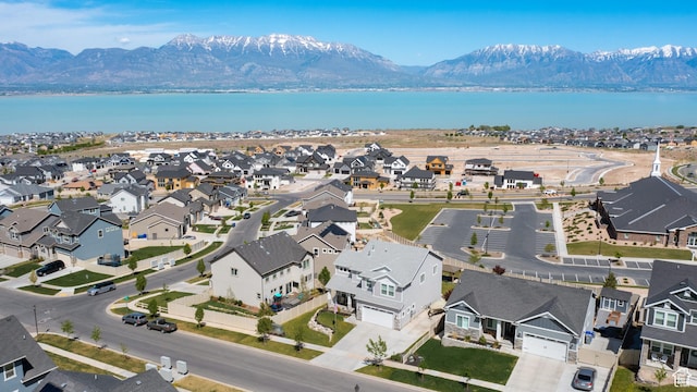 birds eye view of property featuring a residential view and a water and mountain view