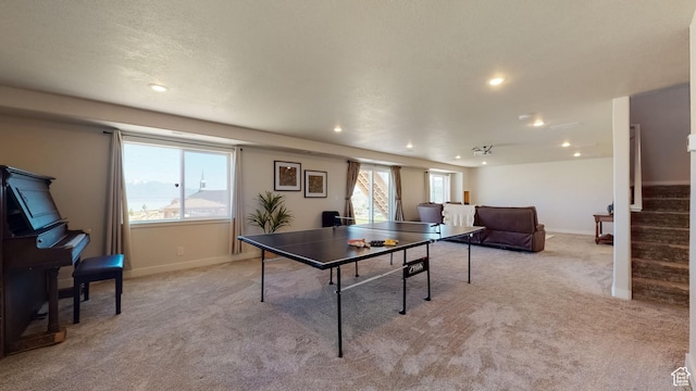 rec room featuring baseboards, recessed lighting, and light colored carpet