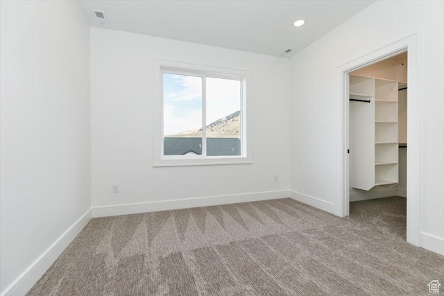 1153 E 160 N, Hyde Park, UT 84318 - unfurnished bedroom with baseboards, carpet, and a walk in closet
