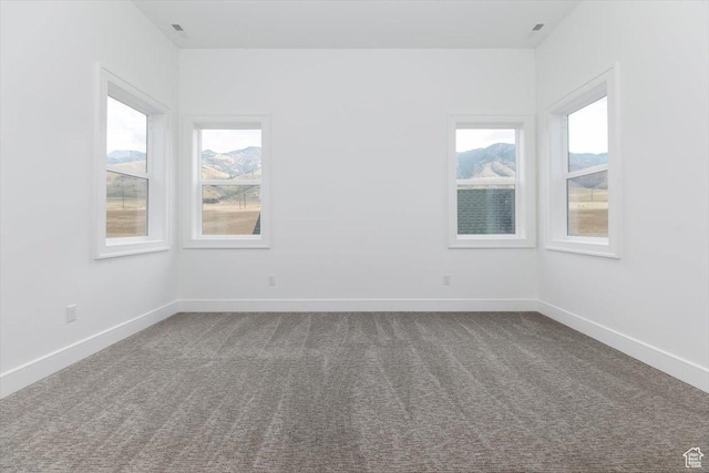 1153 E 160 N, Hyde Park, UT 84318 - spare room featuring dark carpet and baseboards