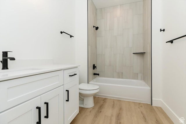 1153 E 160 N, Hyde Park, UT 84318 - bathroom featuring wood finished floors, vanity, washtub / shower combination, and toilet