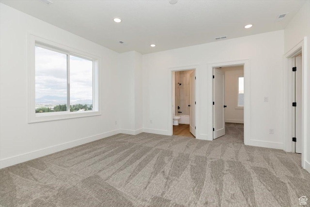 1153 E 160 N, Hyde Park, UT 84318 - unfurnished bedroom with ensuite bath, baseboards, carpet floors, and recessed lighting