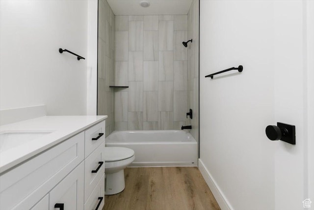 1153 E 160 N, Hyde Park, UT 84318 - full bathroom with wood finished floors, toilet, vanity, baseboards, and  shower combination