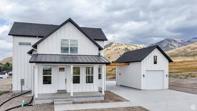 1153 E 160 N, Hyde Park, UT 84318 - modern farmhouse style home with a mountain view, an outbuilding, a standing seam roof, and board and batten siding