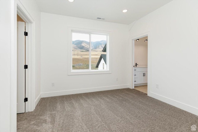1153 E 160 N, Hyde Park, UT 84318 - unfurnished room with recessed lighting, baseboards, visible vents, and light colored carpet
