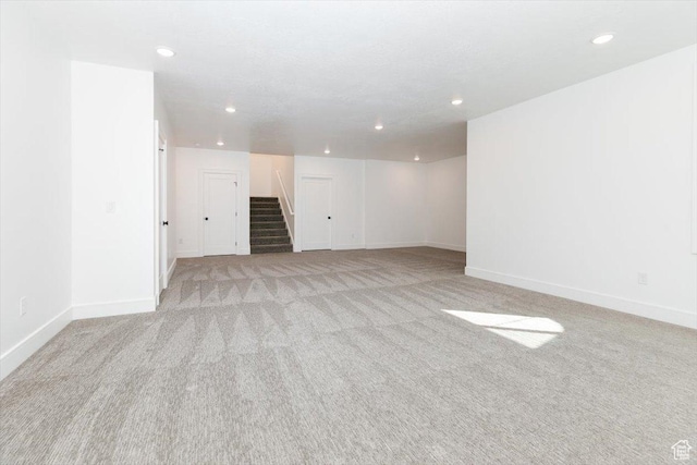 1153 E 160 N, Hyde Park, UT 84318 - unfurnished room featuring light carpet, recessed lighting, and stairway