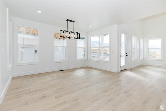 1153 E 160 N, Hyde Park, UT 84318 - unfurnished dining area with recessed lighting, baseboards, light wood-style floors, and a notable chandelier
