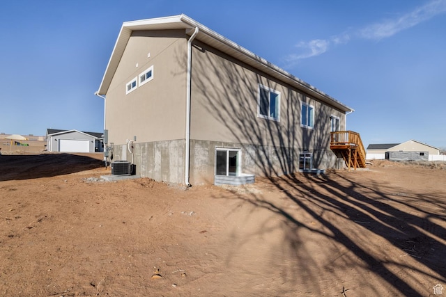 462 E 1035 S, Roosevelt, UT 84066 - rear view of house featuring a garage and central AC unit