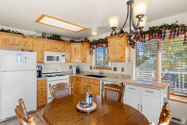 213 Lewis Loop Unit 38, Fish Haven, ID 83287 - kitchen with white appliances, hanging light fixtures, sink, and a wealth of natural light