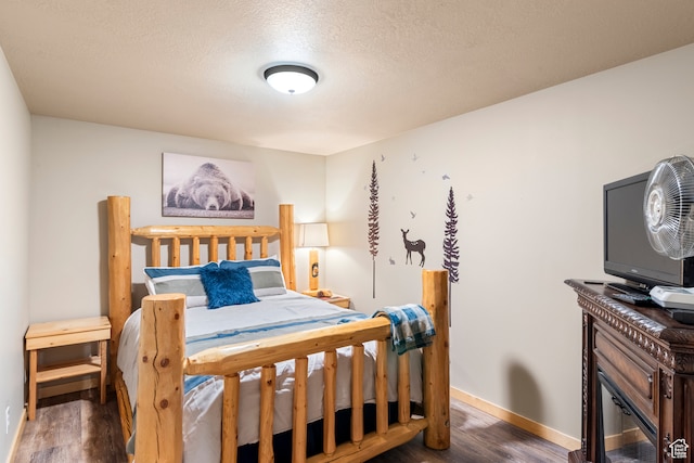 213 Lewis Loop Unit 38, Fish Haven, ID 83287 - bedroom with dark hardwood / wood-style floors and a textured ceiling