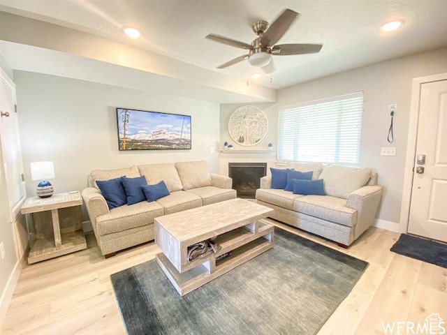 942 N Newberg Dr Unit 2, Garden City, UT 84028 - living area featuring recessed lighting, light wood-style floors, baseboards, a fireplace, and ceiling fan