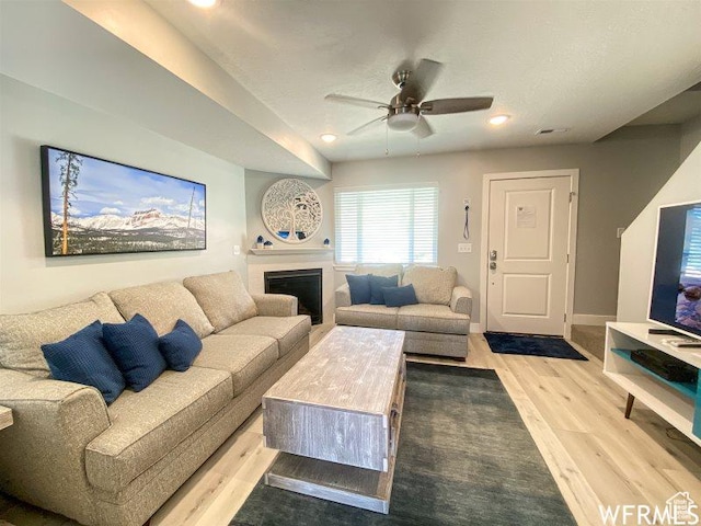942 N Newberg Dr Unit 2, Garden City, UT 84028 - living area featuring ceiling fan, a fireplace, light wood finished floors, and recessed lighting