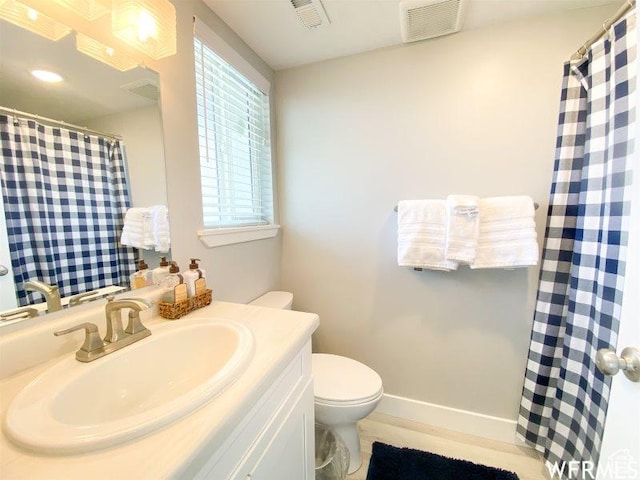 942 N Newberg Dr Unit 2, Garden City, UT 84028 - full bath with baseboards, visible vents, vanity, and toilet