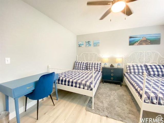 942 N Newberg Dr Unit 2, Garden City, UT 84028 - bedroom with baseboards, a ceiling fan, and wood finished floors