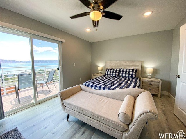 942 N Newberg Dr Unit 2, Garden City, UT 84028 - bedroom featuring light wood-style flooring, a water view, baseboards, recessed lighting, and access to outside