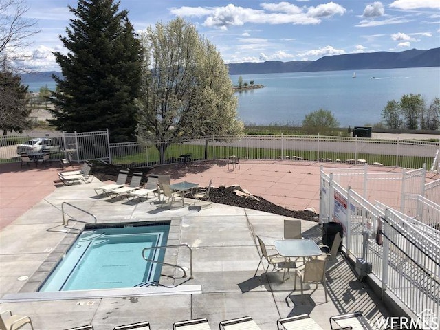 942 N Newberg Dr Unit 2, Garden City, UT 84028 - community pool featuring fence, a water and mountain view, and a patio