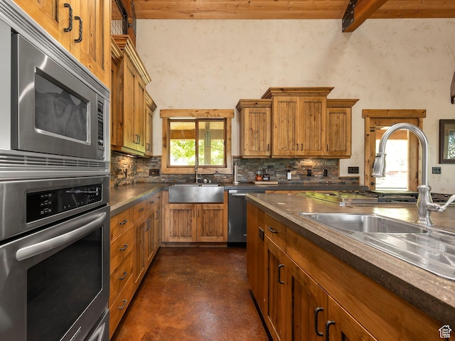 2050 W 2130 N, Helper, UT 84526 - kitchen with brown cabinetry, a sink, and stainless steel appliances