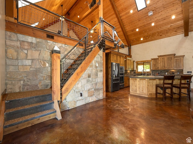 2050 W 2130 N, Helper, UT 84526 - kitchen featuring high vaulted ceiling, wooden ceiling, appliances with stainless steel finishes, a sink, and brown cabinets