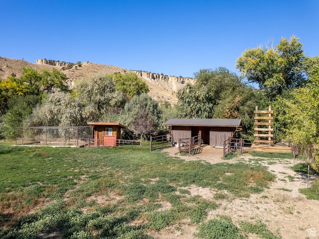 2050 W 2130 N, Helper, UT 84526 - view of yard featuring an exterior structure, an outdoor structure, a mountain view, and a rural view