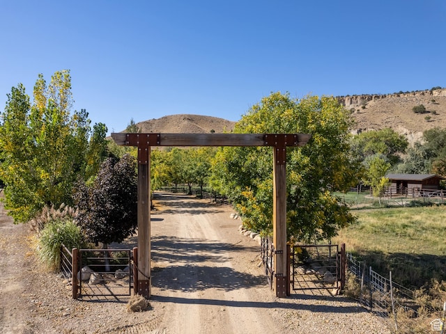 2050 W 2130 N, Helper, UT 84526 - view of home's community featuring dirt driveway, a rural view, fence, a gate, and a mountain view