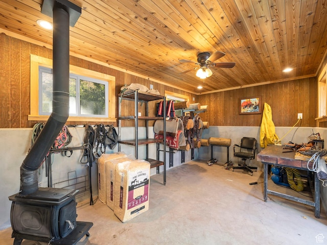 2050 W 2130 N, Helper, UT 84526 - interior space with wood walls, a wood stove, wooden ceiling, and ceiling fan
