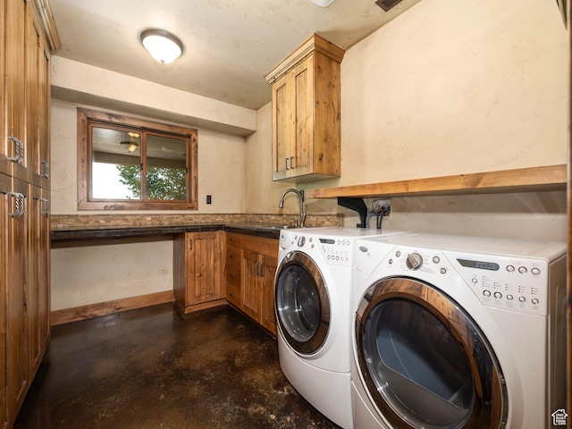 2050 W 2130 N, Helper, UT 84526 - clothes washing area with separate washer and dryer, baseboards, a sink, and cabinet space