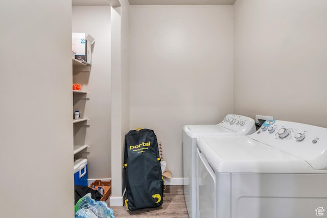 548 E 300 N, Vineyard, UT 84059 - laundry area featuring wood finished floors, washer and dryer, laundry area, and baseboards