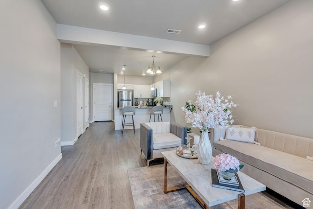 548 E 300 N, Vineyard, UT 84059 - living area featuring recessed lighting, an inviting chandelier, light wood-style floors, visible vents, and baseboards