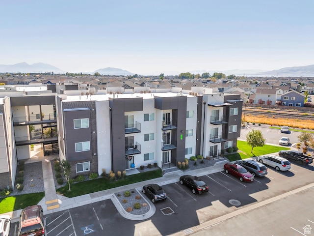 548 E 300 N, Vineyard, UT 84059 - view of building exterior with a mountain view, a residential view, and uncovered parking