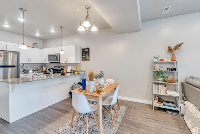 265 N 670 E, Vineyard, UT 84059 - dining room with visible vents, light wood-style flooring, and baseboards