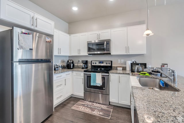 265 N 670 E, Vineyard, UT 84059 - kitchen with stainless steel appliances, white cabinets, dark wood-style floors, and a sink