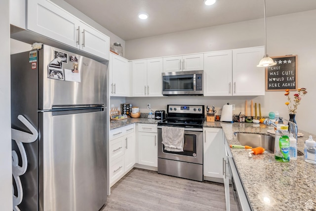 265 N 670 E, Vineyard, UT 84059 - kitchen with appliances with stainless steel finishes and white cabinets