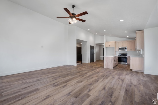 292 500 N, Santaquin, UT 84655 - kitchen featuring open floor plan, light countertops, light brown cabinetry, stainless steel appliances, and light wood-style flooring