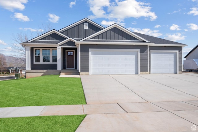 292 500 N, Santaquin, UT 84655 - view of front of house with a front yard, driveway, board and batten siding, and an attached garage