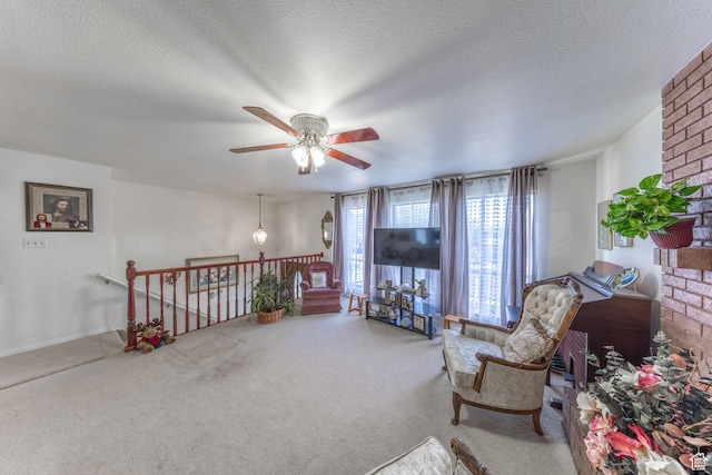 27 E Monticello Dr S, Kaysville, UT 84037 - living area featuring a ceiling fan, an upstairs landing, a textured ceiling, and carpet