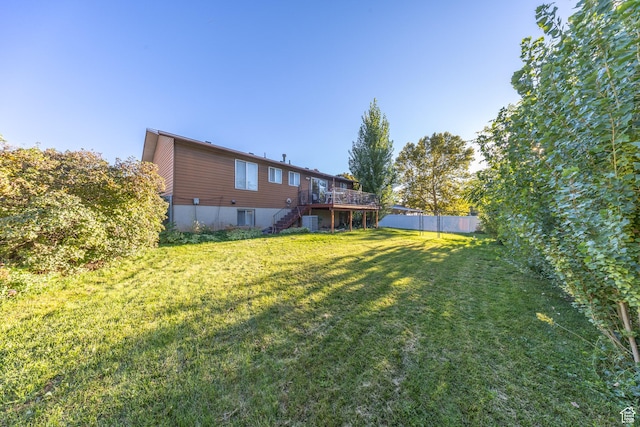 27 E Monticello Dr S, Kaysville, UT 84037 - view of yard featuring fence, a wooden deck, stairs, and cooling unit