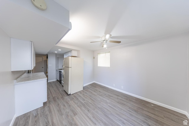 27 E Monticello Dr S, Kaysville, UT 84037 - kitchen with light countertops, freestanding refrigerator, light wood-type flooring, baseboards, and ceiling fan