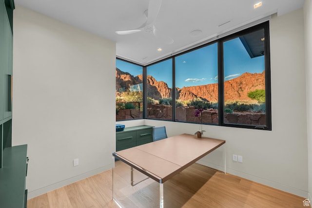 973 W Sipala Trl, Ivins, UT 84738 - office featuring ceiling fan, expansive windows, and light hardwood / wood-style flooring