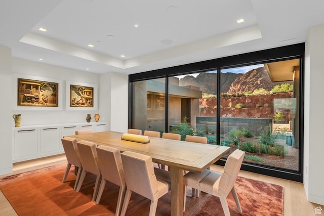 973 W Sipala Trl, Ivins, UT 84738 - dining room with a tray ceiling and light hardwood / wood-style flooring
