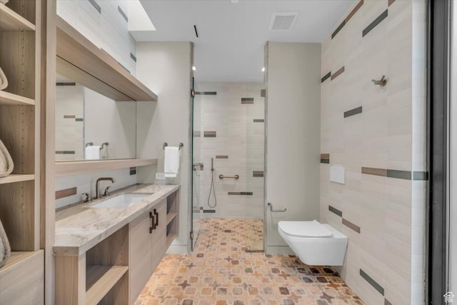 973 W Sipala Trl, Ivins, UT 84738 - bathroom with tile walls, a shower with shower door, vanity, and toilet