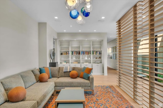 973 W Sipala Trl, Ivins, UT 84738 - living room featuring light wood-type flooring and a healthy amount of sunlight