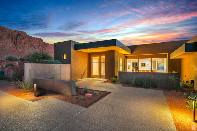 973 W Sipala Trl, Ivins, UT 84738 - view of front of home featuring a patio and a mountain view