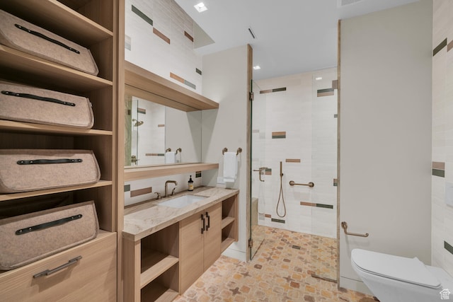 973 W Sipala Trl, Ivins, UT 84738 - bathroom featuring vanity, a shower with door, toilet, and tile walls