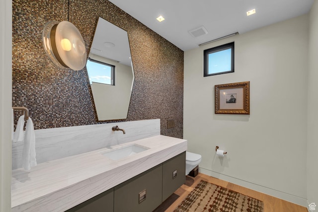 973 W Sipala Trl, Ivins, UT 84738 - bathroom with hardwood / wood-style floors, vanity, and toilet